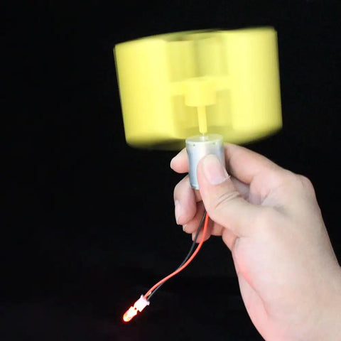 Person holding a DIY Wind Turbine Generator Kit With 360 Degree Rotatable Blades And DC Motor for science education demo