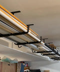 Heavy Duty Ceiling Storage Hooks For Garage Set Must Have, Overhead Rack To Hang Lumber, Ladders, Pipes, Fishing Rods, Bikes And Gear, Space Saving J Hooks, 2 Pack, Sturdy Ceiling Mounted Organizer holding lumber and materials.