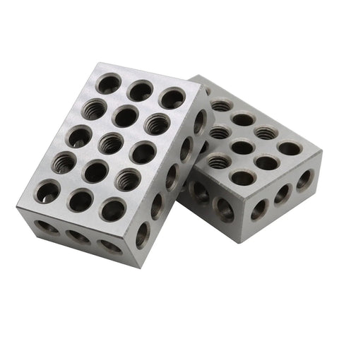 Two silver Aspaton 123-block calibration blocks with 23 threaded holes for precision setup