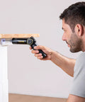 Top Shelf Electric Screwdriver With Pivoting Handle And Crisp Digital Torque Display Featuring Eight Precise Settings For Laptop Repair And Diy Tasks That Deliver Knockout Precision Every Time in use, adjusting screws on furniture.