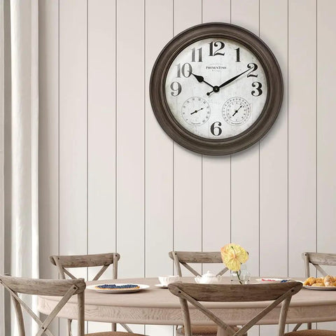 26 Inch Indoor And Outdoor Farmhouse Clock With Thermometer And Hygrometer All In One Weather Station Wall Art And Timepiece For Home Decor In Grey Oak Finish UV Resistant mounted on dining area wall.
