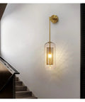 Lowkey Chill Modern Wall Sconces With Smooth Glass Shades And Glare Free LEDs That Really Bring Premium Vibes To Living Rooms And Bedrooms For Total Home Glow Up, gold frame with glass shade in staircase.
