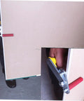 Portable Gypsum Board Lifter Set With Adjustable Angle Grip For Hassle Free Drywall And Ceramic Tile Transport Labor Saving Lightweight Carry Tool No Sweat Material Handling close-up showing grip mechanism on drywall panel.