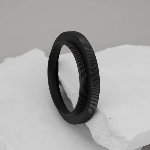 Close-up of M48 To M54 Telescope Thread Conversion Adapter For Photography Lenses, black anodized aluminum, durable and corrosion-resistant.