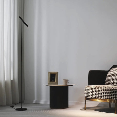 Tall LED Floor Lamp With Foot Switch 66 Inch Modern Standing Lamp next to a chair and table in a living room setup