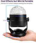 Person holding a mini 2 Pack Portable Sound Activated Party Lights Indoor DJ Disco Ball Strobe Lights Battery Or USB Powered