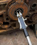 Amazon TIANAOKEJI internal bearing puller tool with slide hammer clamped to rusty engine gear (front view)