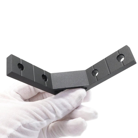 10 Pack 78x78mm 2020 Aluminum T Slot Corner Brackets Set held in gloved hand, showing 90-degree angle, black finish.