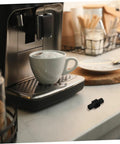 Espresso Steam Wand Sleeve Heatproof Rubber Insulation Cover on coffee machine with cup of coffee in kitchen setting