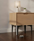 Black Cold Rolled Steel Furniture Leg 3.9 Inch Height Replacement for Sofa, Cabinet, And Table supports a wooden cabinet.