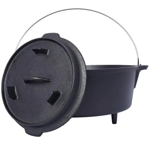 Black cast iron Dutch oven with lid and handle, featuring sturdy design and three legs, perfect for outdoor cooking and camping.