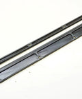 Delta Sidekick Ten Inch Throat Plate Insert, Two And A Quarter Inch By Fifteen And A Quarter Inch Standard Kerf Zero Point Three Five in black material on a white surface, showing its smooth surface and precise cutouts for easy install.