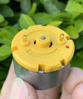 Close-up of a Two Pack RC500 KN Mini 32mm Round Spindle Motor DC 6V 12V 5300 RPM High Torque Carbon Brush held in hand outdoors