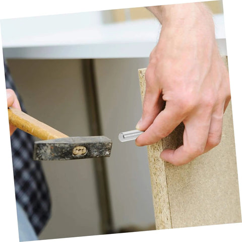 Person using hammer to insert pin from 100 Piece Stainless Steel Positioning Pins Set For Quick Precise Component Alignment In Machinery And Electronics Plug And Play Ready Solid Rod Fasteners With Burr Free Smooth Finish For Reliable Fixtures And Easy Setups