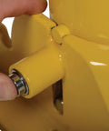 Lockable Steel Fold Down Bollard Parking Barrier Rock Solid Safety Post with hand engaging the lock mechanism.