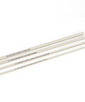 Top-Shelf Stainless Steel Bore Alignment Rod For 6.5 Creedmoor, four stainless rods laid flat with clear markings.