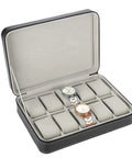 Top Shelf 10 Grid Watch Storage Box With Cushioned Dividers For Organizing Your Cool Watch Collection On The Go Or Desk Display Plus Ring Holder And Travel Essentials Case, opened view with two watches in cushioned slots.