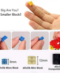 London Skyline Micro Mini Blocks showing hand holding yellow block and comparisons of blue, red, and black dOvOb blocks