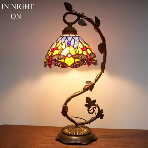 Dragonfly Tiffany Style Table Lamp with Blue and Yellow Stained Glass Shade Bronze Metal Leaf Base 21 Inch Tall Night View