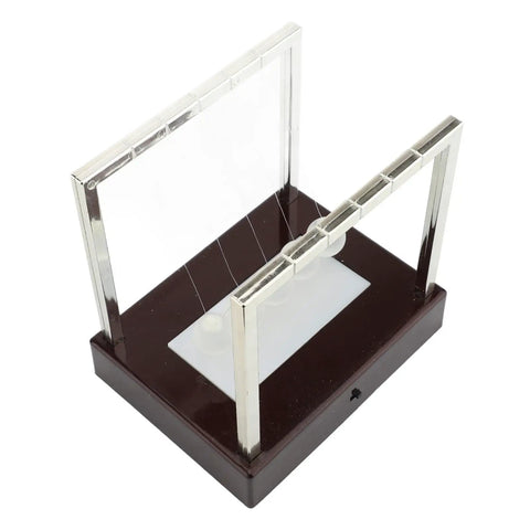 Top view of Classic Desk Pendulum Toy With Stable Base Cradle Science Gadget For Energy Transfer on wooden base