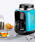 Hassle Free Mini Coffee Maker With Built In Bean Grinder And Glass Carafe, Solid Six Cup Drip Brewer on kitchen counter.
