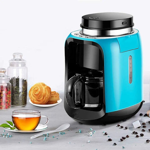 Hassle Free Mini Coffee Maker With Built In Bean Grinder And Glass Carafe, Solid Six Cup Drip Brewer on kitchen counter.