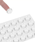 24 Pack Clear Self Adhesive Rubber Feet For Glass Tables And Drawers Rock Solid Anti Slip Bumpers lifted from backing sheet.