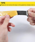 Self-adhesive fiberglass wood stove gasket tape; close-up of yellow backing being peeled away from dark gray gasket.