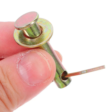 Heavy Duty Metal Shear Pins With Locking Mechanism For Ceiling Fan Pulley And Receiver Trailer Hitches held in hand.