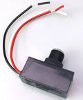 Outdoor Dusk To Dawn Sensor Switch with weatherproof plastic casing and copper conductor, wires exposed, shown from above