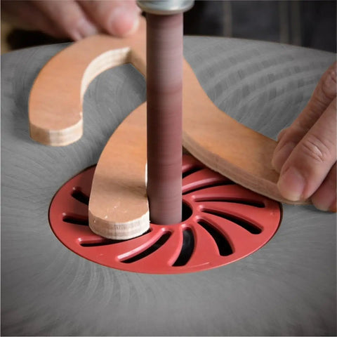 Pro Grade 4.5 Inch Sanding Sleeves Set For Spindle Sander in use with wood, showing detail of spindle and sanding sleeve