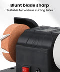 Close-up of Workhorse Dual Wheel Electric Knife Sharpener And Polisher with cutting tool on grinding plate for blade sharpening.