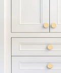 Heavyweight Solid Brass Brushed Gold Cabinet Knobs 0.94 Inch Diameter 24mm 8 Pack on white kitchen cabinets