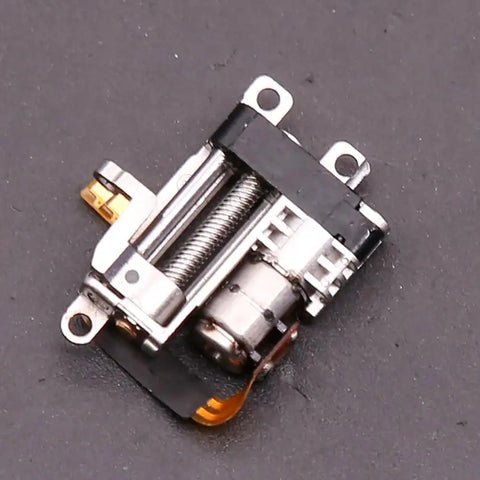 Badass Compact Linear Actuator Packing Smooth Planetary Gearbox And Solid Metal Mini Stepper Motor 2 Phase 4 Wire Dead Silent Performance Slick 10 Mm Throw For Garage Projects And Mods, close-up of mini stepper motor and gearbox.