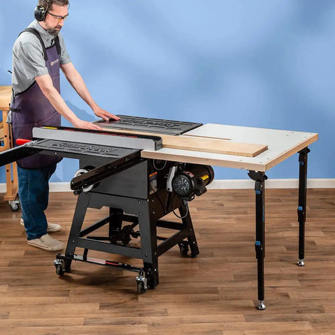 Man using Knock Down Outfeed Table Kit With Foldable Legs For Small Shops on a table saw, showcasing extension and setup.