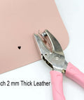 Handheld Paper Hole Punch With Pink Leather Cover punching 2mm thick leather, heart pattern shown