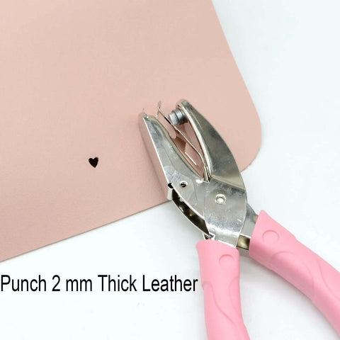 Handheld Paper Hole Punch With Pink Leather Cover punching 2mm thick leather, heart pattern shown