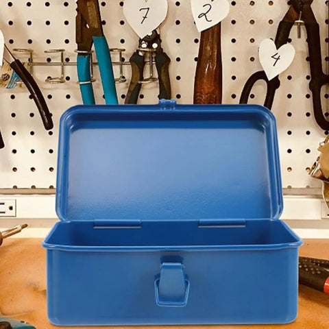 Open classic vintage blue metal toolbox on a workbench, perfect for auto repair and home fix ups. Heavy duty and portable.
