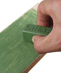 Hand using Dope Green Polishing Compound For Sharpening And Buffing Ultrafine Aluminum Oxide And Chromium Oxide Blend 1 To 2 Micron Particles