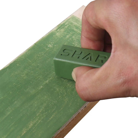 Hand using Dope Green Polishing Compound For Sharpening And Buffing Ultrafine Aluminum Oxide And Chromium Oxide Blend 1 To 2 Micron Particles