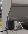 Side view of Universal Rotisserie Kit for 2-4 burner gas grills, showing motor and mounting bracket on grill