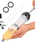 Side view of SOWKIPE 200cc automotive fluid extractor pump with two clear hoses and black cap, held by hand