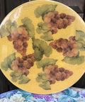 Wine Motif Lazy Susan 15 Inch Wood Rotating Tray with grape design on a wooden surface, suitable for dining table decor and entertaining.