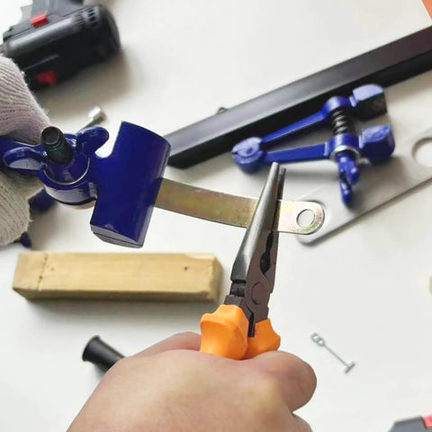 Portable Hand Vise For DIY Projects With A 2 Inch Jaw Heavy Duty Handheld Vice in use for cutting a metal piece in a workshop