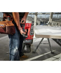 Tough As Nails Cordless Belt Sander With 3X18 Wide Sanding Path And Beefy Brushless Motor For Kickin Up Dust Faster With Slick Variable Speed And Smooth Zero Vibration Control in use on a workbench.
