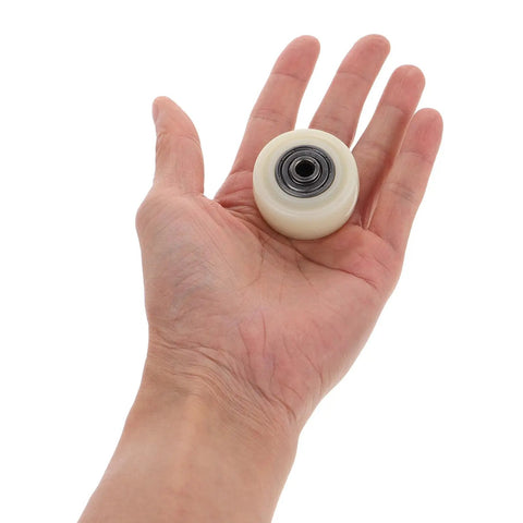 1.5 Inch Nylon Caster Wheel held in hand, part of Top Notch 4 Pack 1.5 Inch Nylon Caster Wheels level up home setup.