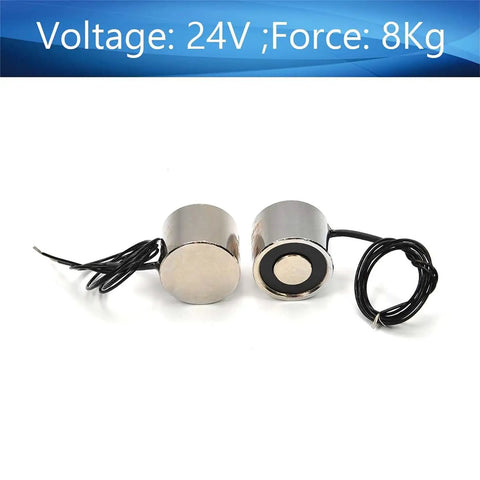 Two Pack 24V Electric Lifting Magnet With 8 Kg Pull, Circular Suction Cup Electromagnet showing two round metal devices with wires.