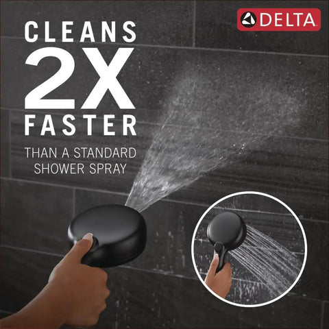 ProClean Matte Black Shower Head with Handheld spraying high-pressure water for quick clean, visible in hand against dark tiles.