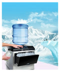Pro Hustle Electric Countertop Bullet Ice Maker Machine For Home RV Campsite with water barrel, producing ice in a cold setting.
