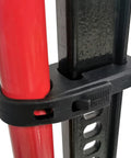Rugged Black Hi-Lift Jack Handle Keeper For Farm Jacks securing red jack handle to black steel bar with silicone strap.